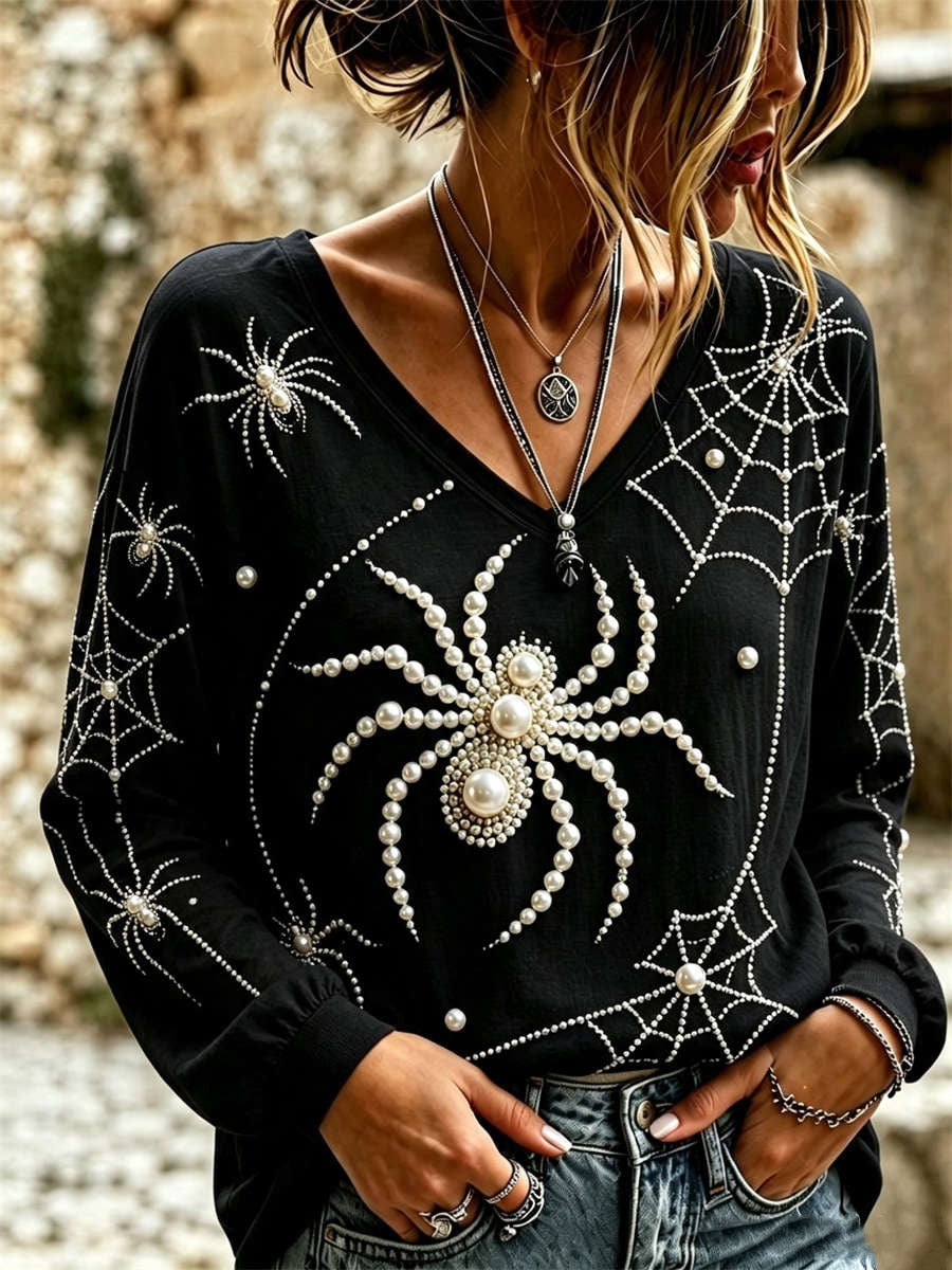Delphine spiderweb v neck blouse in black, front view