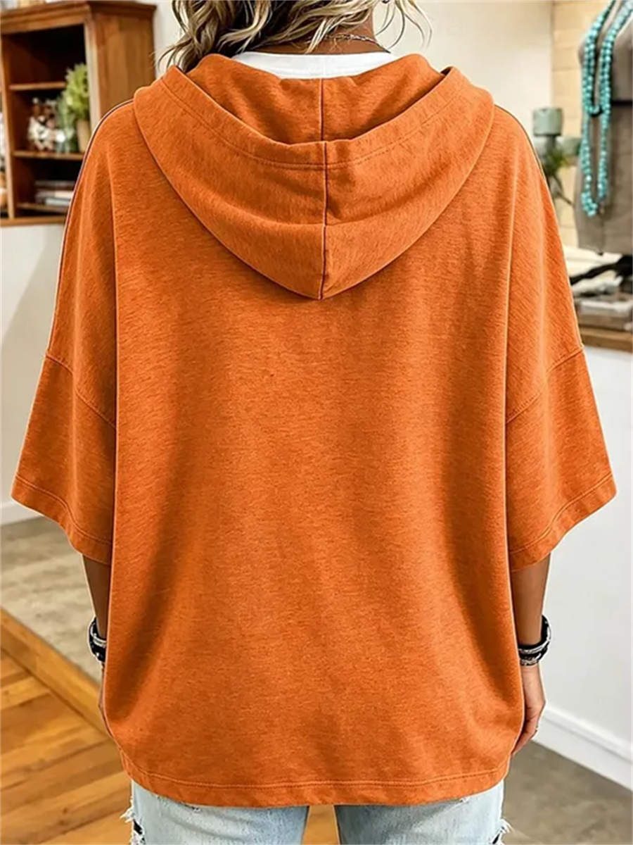 Aria pumpkin face hoodie in orange, back view