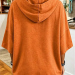 Aria pumpkin face hoodie in orange, back view