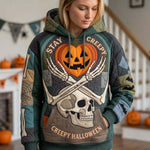 Addison Creepy Skeleton Pumpkin Hoodie in green, blue, beige, front view worn by a model