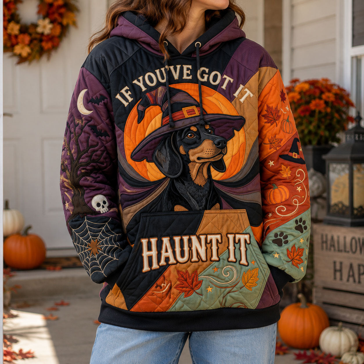 Brielle Witch Dachshund Hoodie in purple, orange, black, front view worn by a model