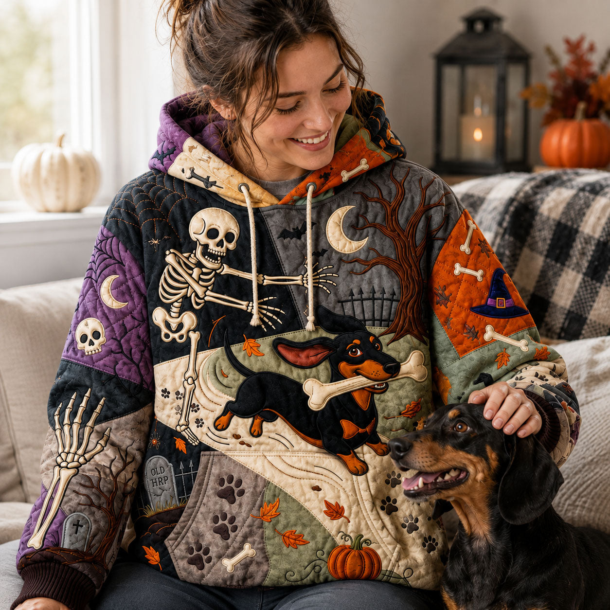 Clara Skeleton Dachshund Hoodie in black, orange, purple, front view worn by a model