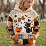 Autumn Ghost Black Cat Hoodie in beige, orange, black, front view worn by a model