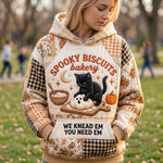 Claire Black Cat Bakery Hoodie in beige, orange, black, front view worn by a model