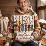 Abigail Autumn Broom Hoodie in beige, orange, brown, front view worn by a model