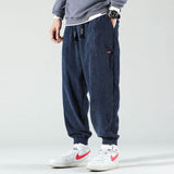 Gerald men's textured cuffed joggers in Navy Blue, front view