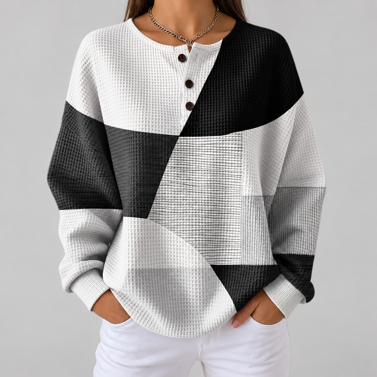 Eleanor black and white patchwork waffle knit sweater, front view