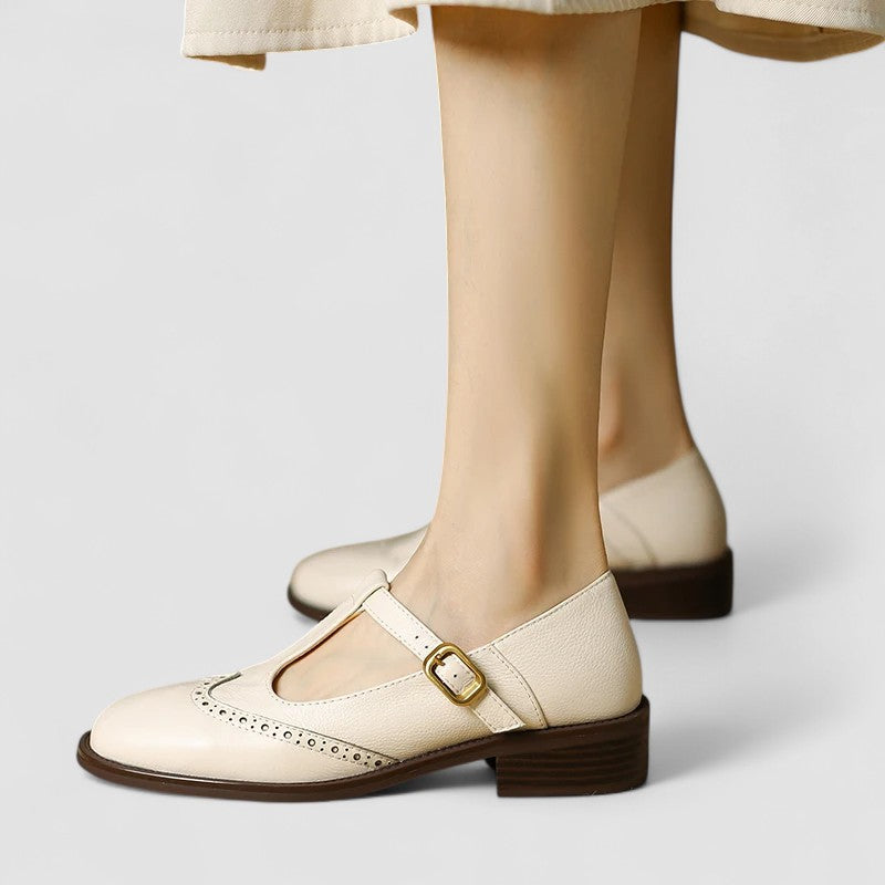 Renee wingtip stacked heel Mary Jane shoes in Cream, front view