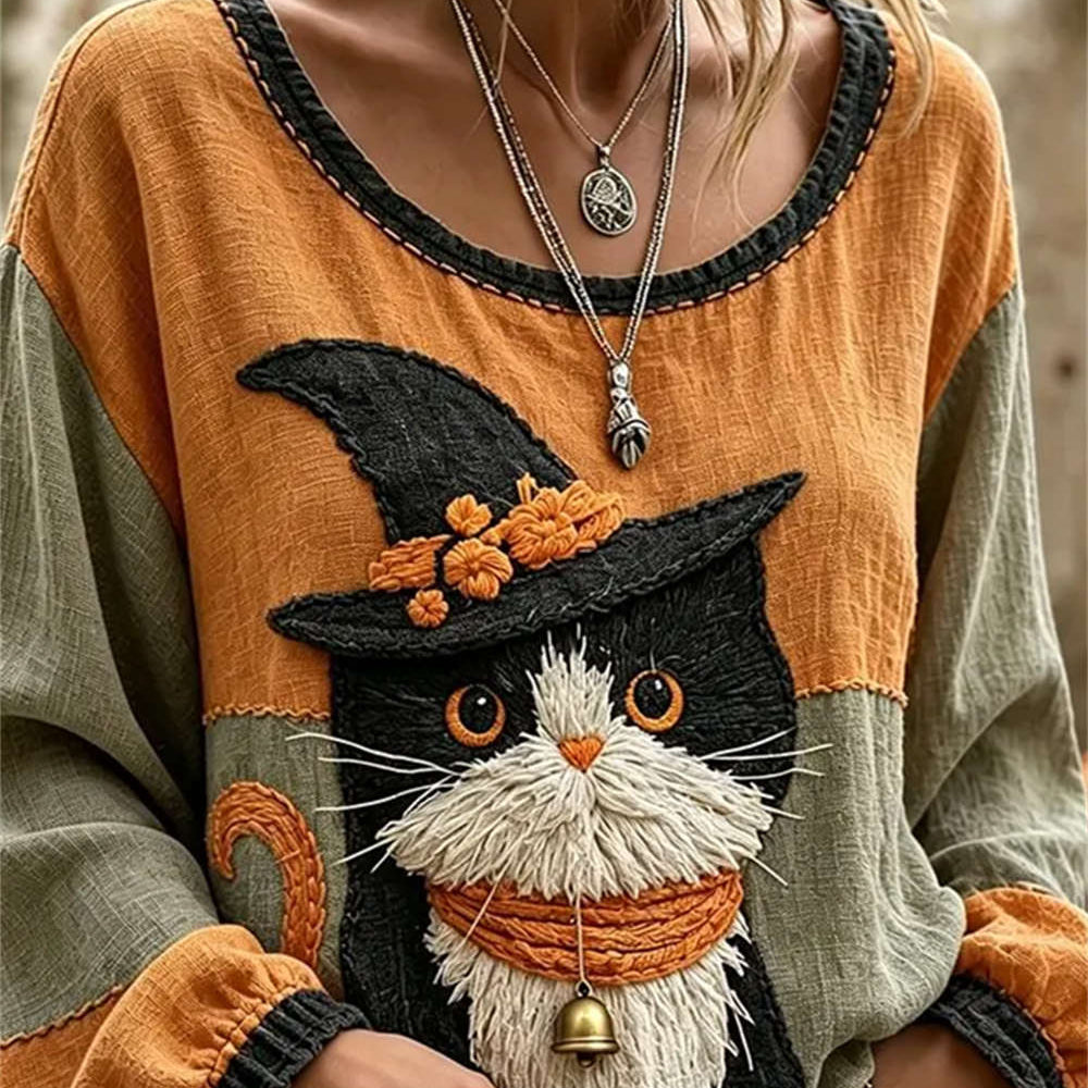 Ruby wizard cat blouse in orange, green, front view