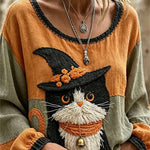 Ruby wizard cat blouse in orange, green, front view