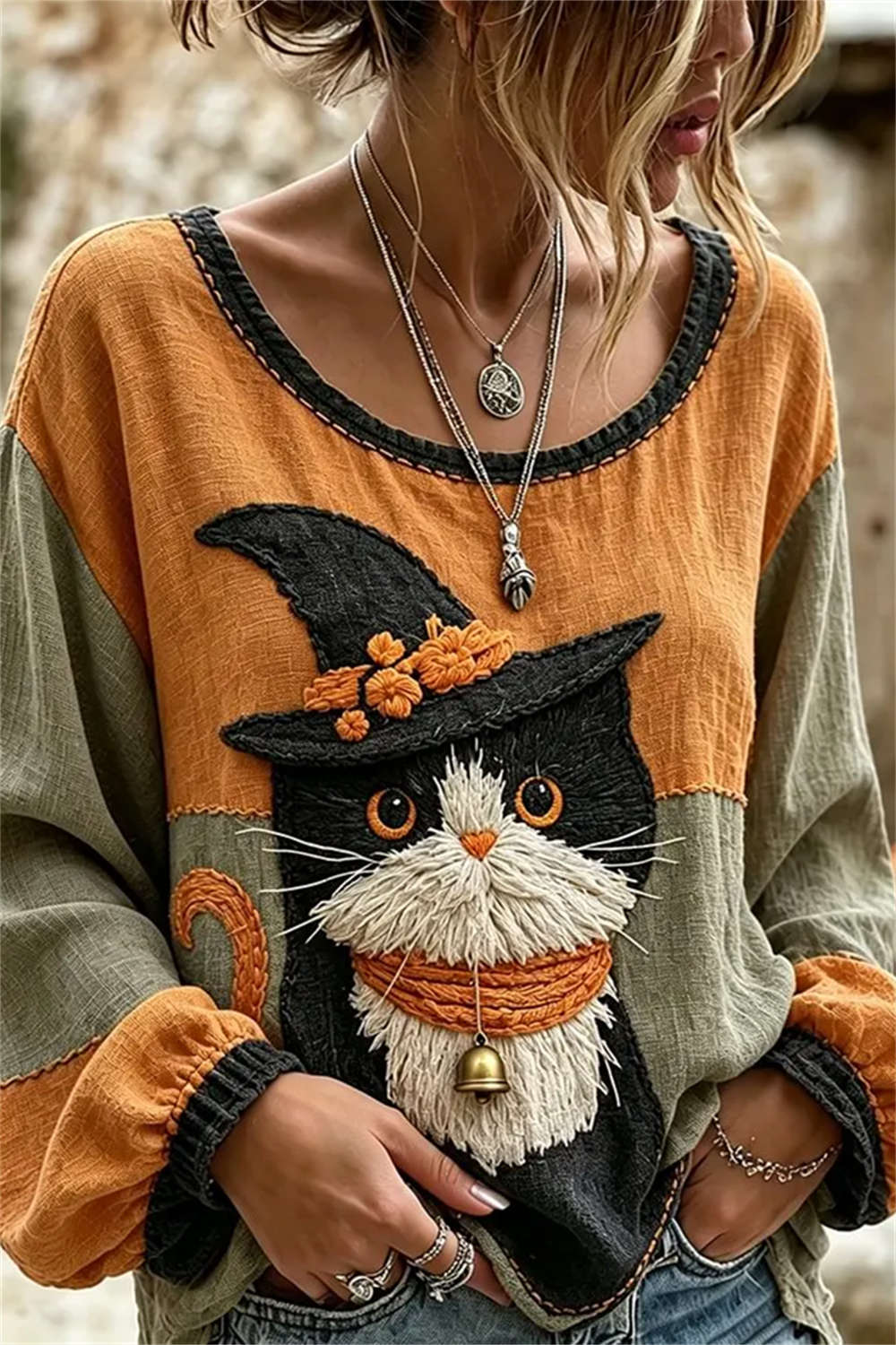 Ruby wizard cat blouse in orange, green, front view