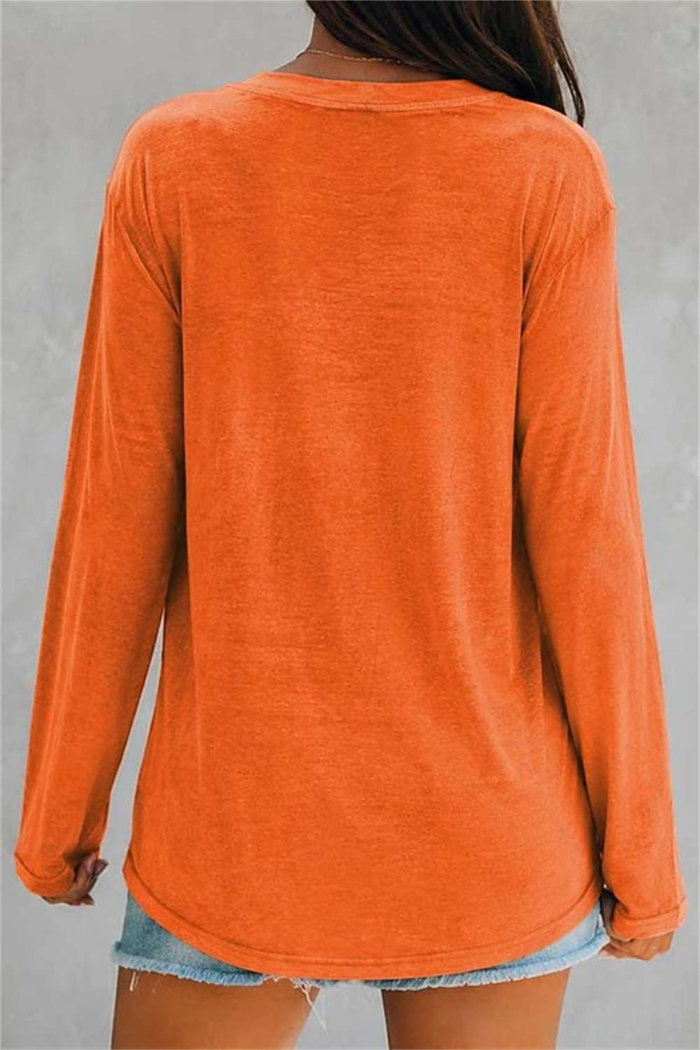 Sadie witch graphic v neck blouse in orange, back view