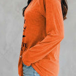 Sadie witch graphic v neck blouse in orange, side view