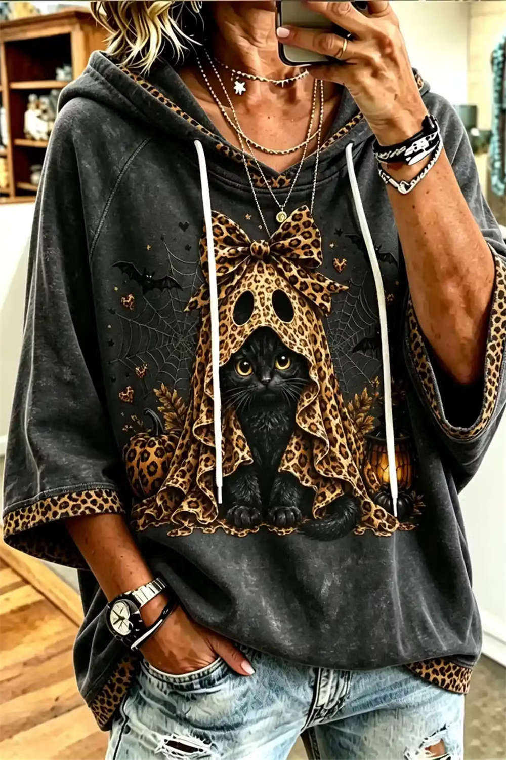 Melody cat and spiderweb hoodie in gray, front view
