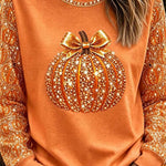 Ivy pumpkin bow top in orange, front view