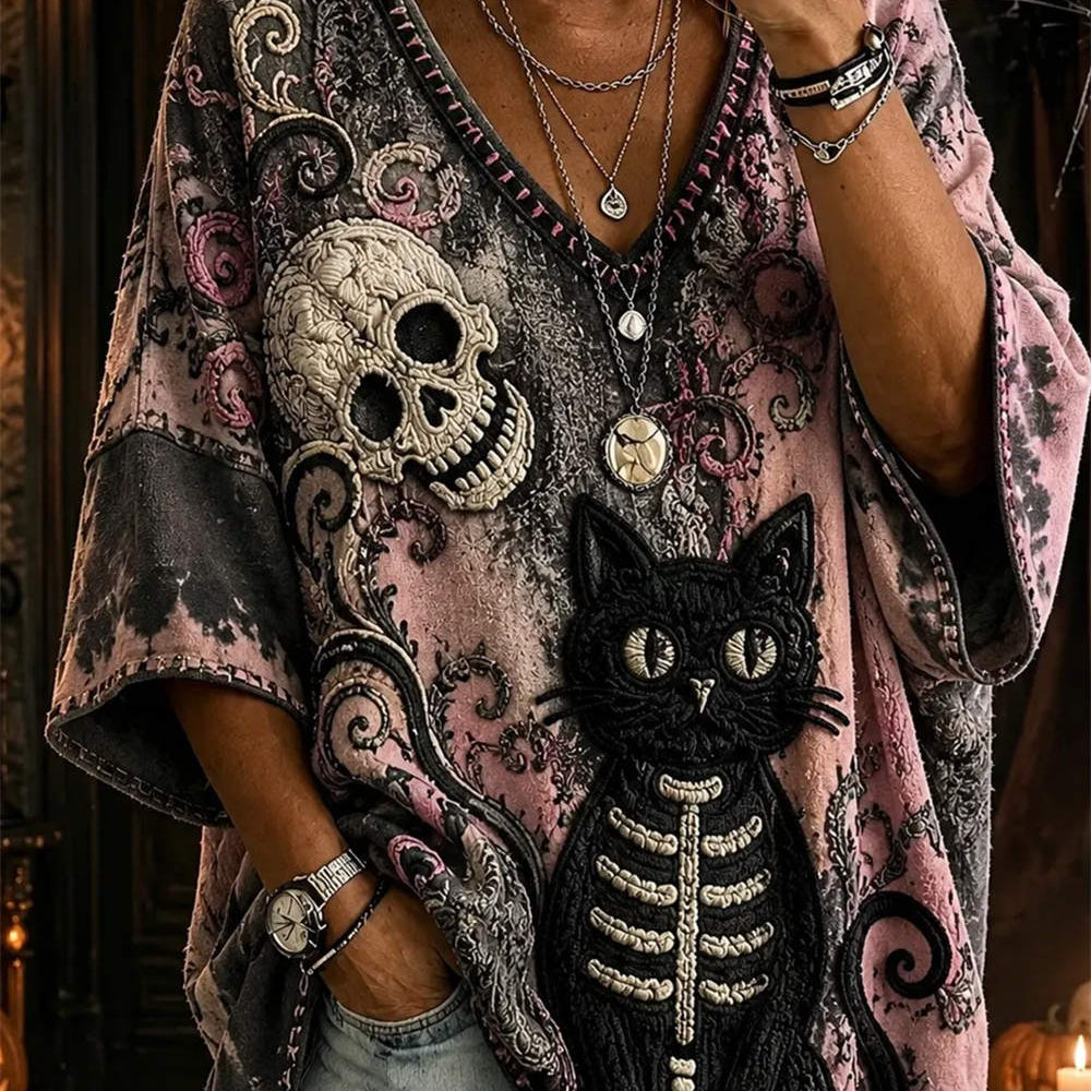 Ada skull cat v neck blouse in black, pink, front view