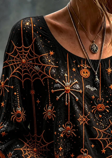 Josephine spiderweb pumpkin blouse in black, orange, detail view