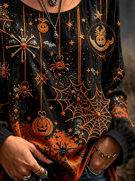Josephine spiderweb pumpkin blouse in black, orange, detail view