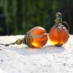 Sofia pumpkin earrings in orange, black, detail view