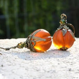 Sofia pumpkin earrings in orange, black, detail view