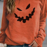 Edith Pumpkin Face Sweatshirt in orange, front view