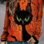 Kara Witch Cat Print Sweatshirt in orange, front view